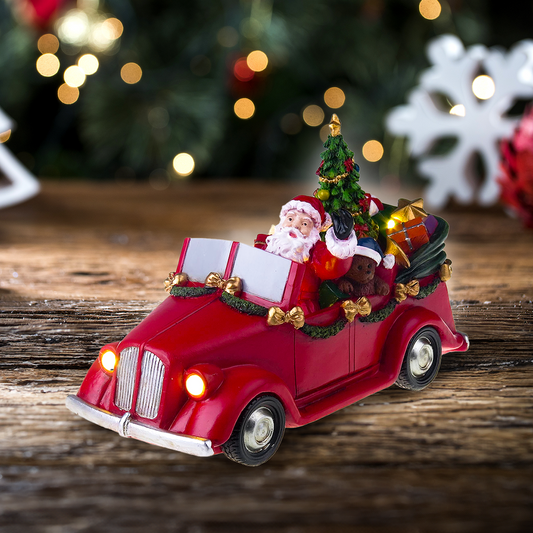 Santa in car with turning tree