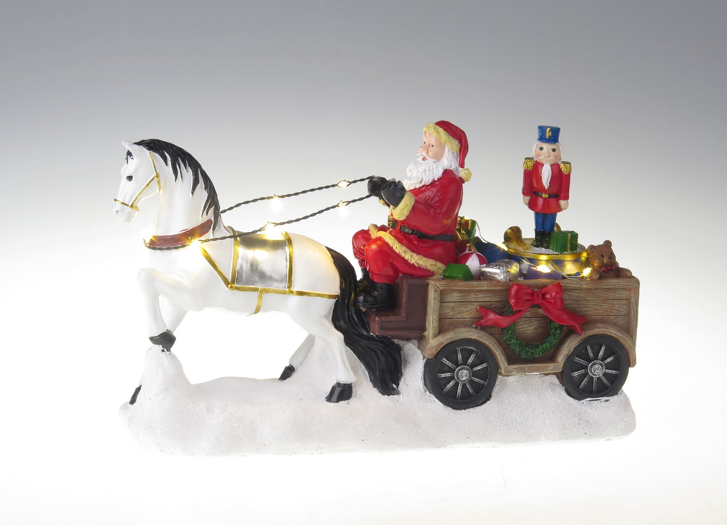 Santa with white horse, wagon and rotation nutcracker